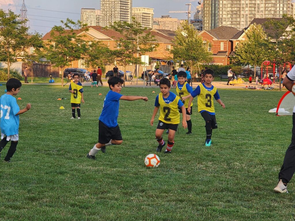 Group of youth soccer players at summer camp in Mississauga
