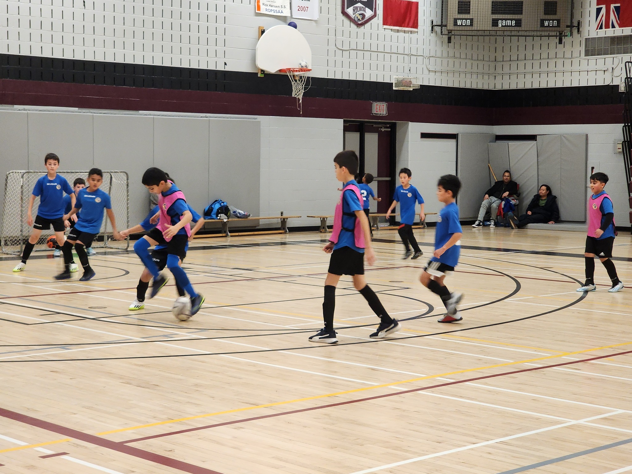 Young soccer players participating in a small-sided game as part of Mississauga youth soccer development program.