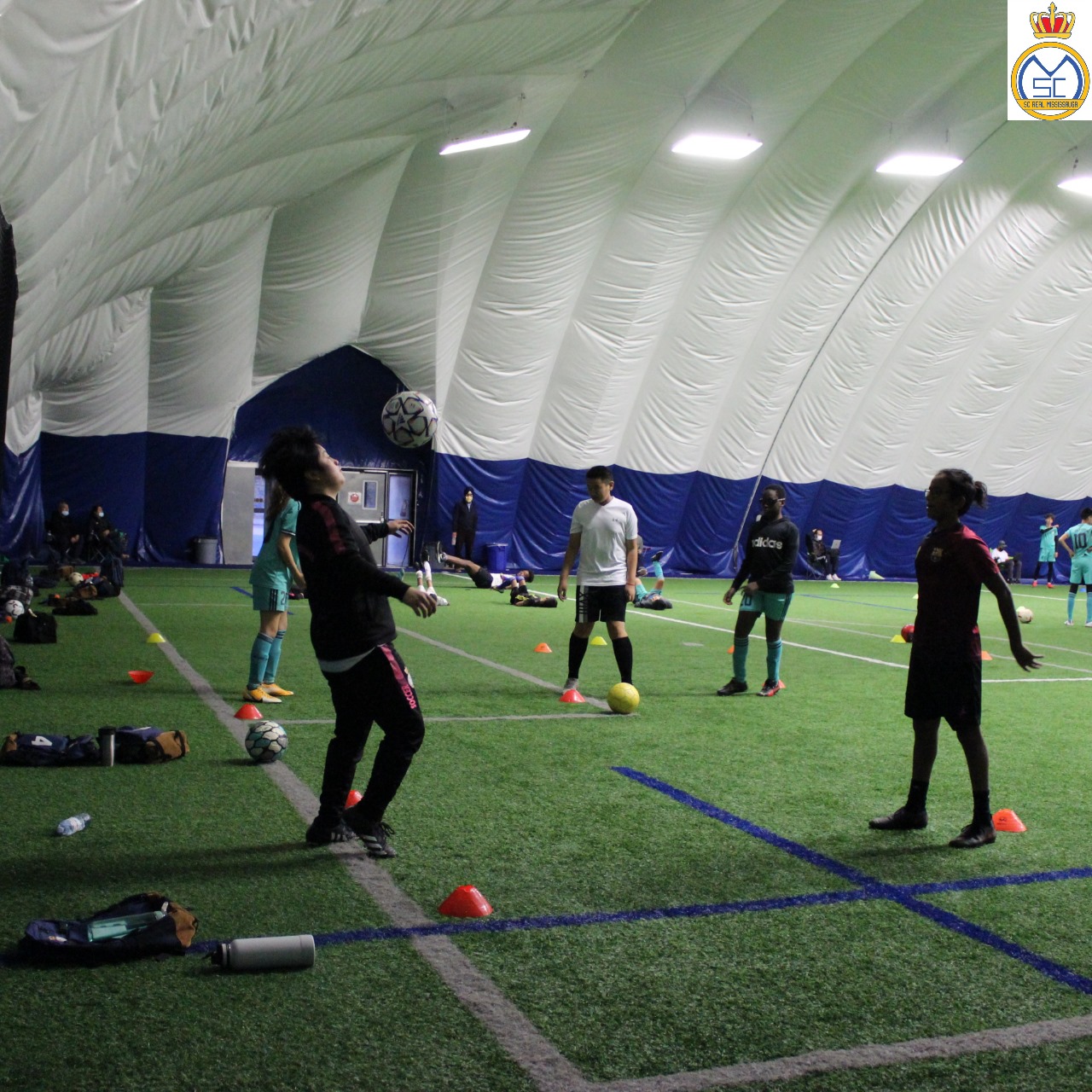 Young girls participating in indoor soccer training during the Fall/Winter Super Girls Program in Mississauga