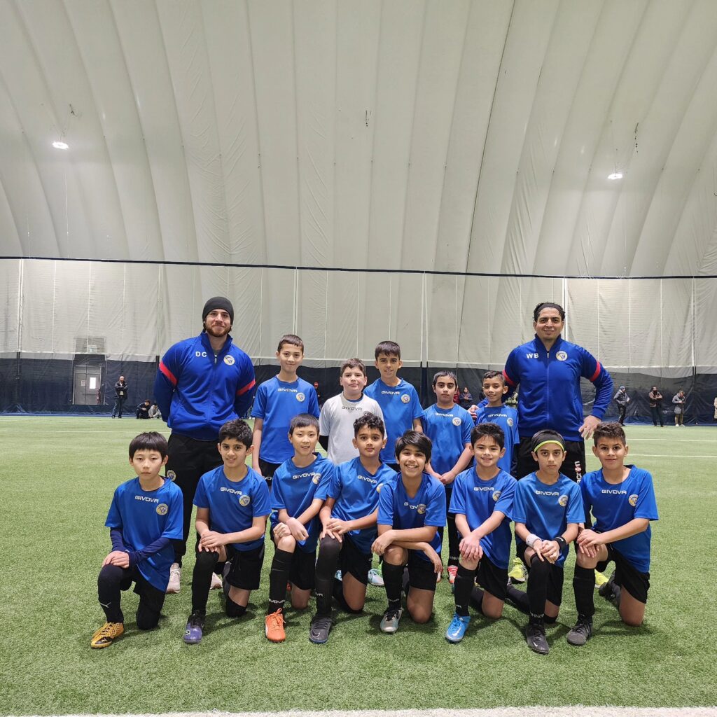 Kids celebrating after a soccer match in Mississauga