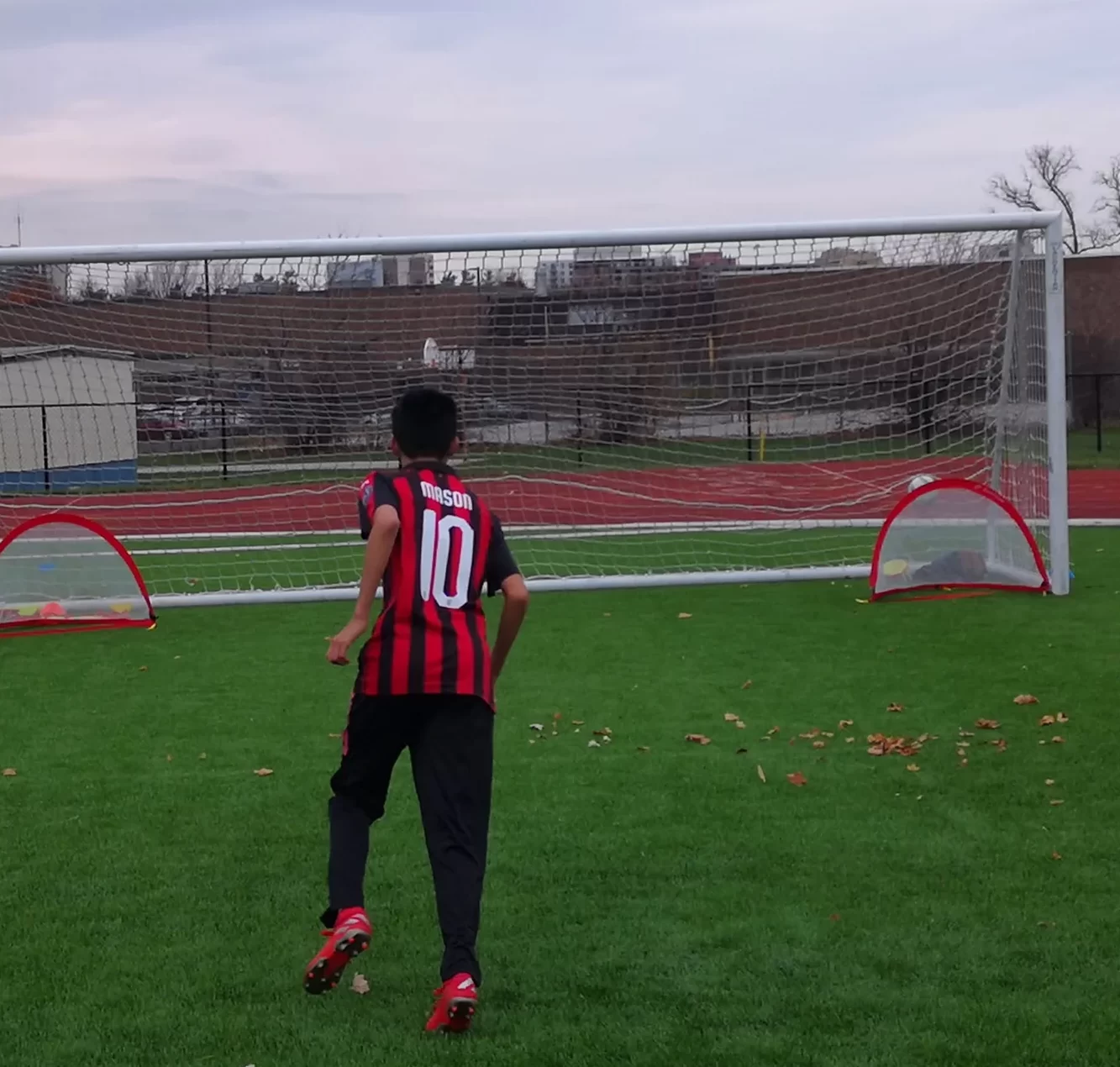 Goalkeeper practicing saves during a soccer training session in Mississauga