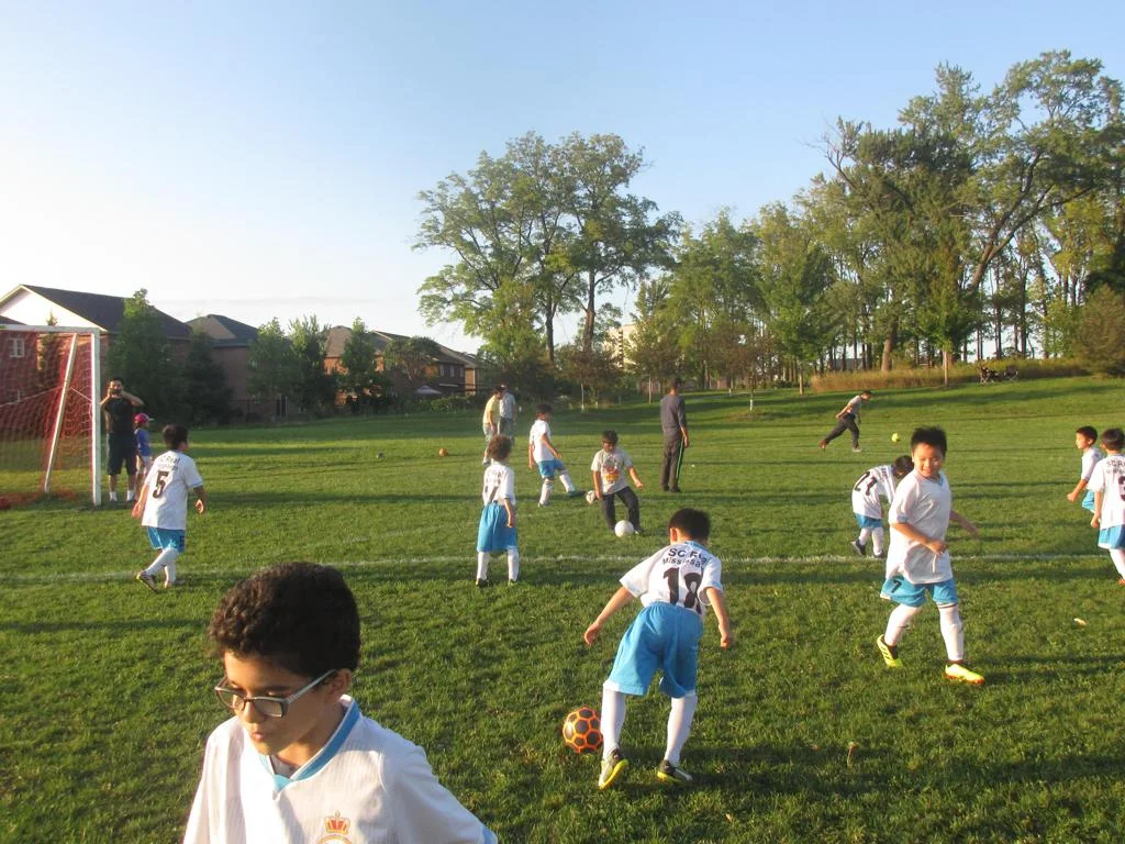Children participating in multi-sport summer camp activities in Mississauga