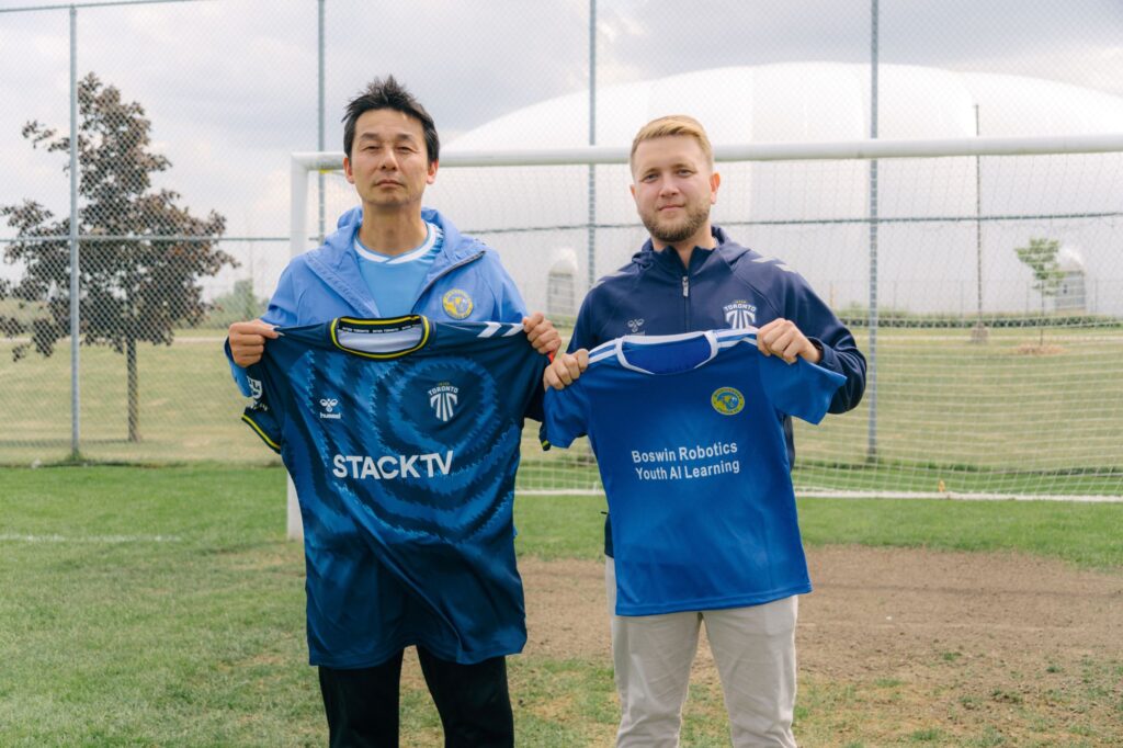 Mississauga United FC and Inter Toronto representatives exchanging club jerseys.